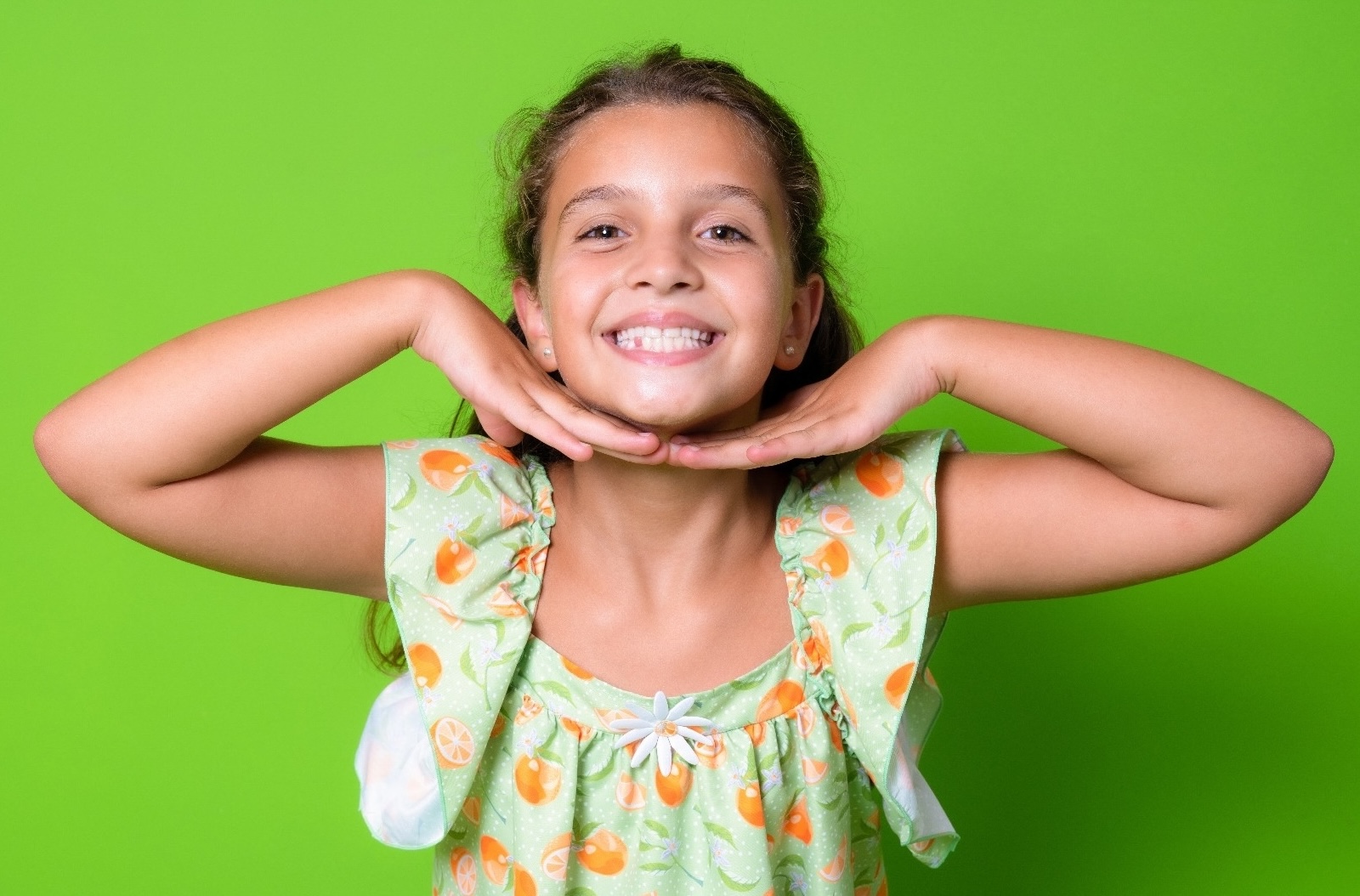 Happy child with arms raised celebrating